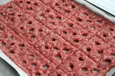 raw ground beef in a baking pan ready to be cooked