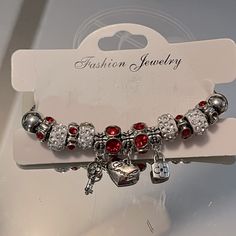 A Pandora Style Bracelet ’Key To My Heart’. 3 Charms, Lock, Key And Heart With Red And Clear Rhinestone Spacers. Heart Clasp. Not Pandora Brand Red Crystal Bracelet Gift, Silver Beaded Bracelets With Bling For Gifts, Red Crystal Bracelet For Gift, Silver Heart Bracelet With Rhinestones, Silver Rhinestone Bracelets For Valentine's Day, Valentine's Day Silver Bracelets With Rhinestones, Red Metal Crystal Bracelet Gift, Valentine's Day Silver Bracelet With Rhinestones, Heart-shaped Rhinestone Bracelet As Gift