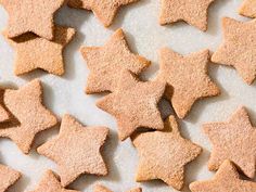 several star shaped cookies on a white surface