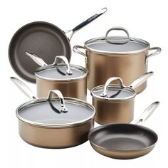 an assortment of pots and pans with lids