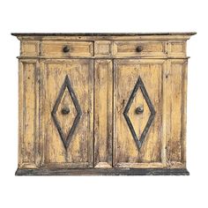 an old wooden sideboard with two doors and diamond designs on the front, isolated against a white background