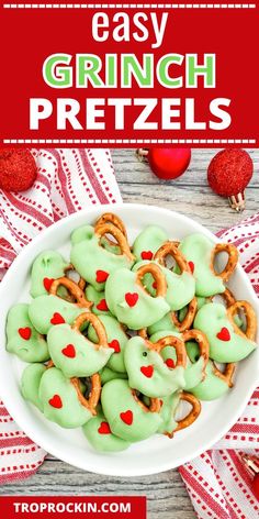 green pretzels in a white bowl with red hearts on the side and text overlay that reads easy grinch pretzels