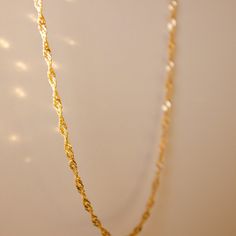 The Adeline twist necklace is an essential piece of jewelry to add to your collection. With a luxe minimal style, this dainty necklace is perfect for everyday layering. Made with non tarnish quality you'll be able to enjoy this piece for many years to come. Treat yourself to a bit of luxury with this classic gold piece. • Single Necklace• Gold Filled• Chain Length: 16" + 1" extender• Chain Thickness: 3mm Elegant Twisted Chain Necklace For Gift, Elegant Twisted Necklace With Adjustable Chain, Elegant Twisted Chain Necklace Gift, Gold Twisted Necklace For Gift, Elegant Twisted Gold Chain Necklace, Everyday Luxury Gold-tone Chain Necklace, Dainty Yellow Gold Tarnish-resistant Chain Necklace, Yellow Gold Plated Delicate Rope Chain Necklace, Minimalist Tarnish-resistant Yellow Gold Chain Necklace