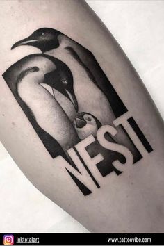 a black and white photo of two penguins with the word nest on it's thigh