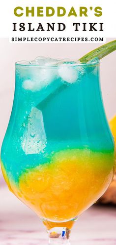 a blue and yellow drink in a glass with the words cheddar's island tiki on it