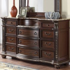 an ornate dresser and mirror in a room