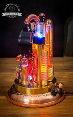 an illuminated device on top of a wooden table