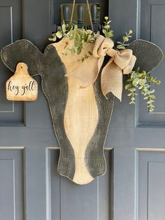 a cow head hanging on the front door