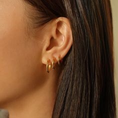 Small 14K Solid Gold huggie hoop earrings that hug your ear perfectly. Available in all sizes. 14K Solid Gold Hypoallergenic, lead and nickel free Thickness 1.5mm Inside Diameter: 8.5mm, 10mm, 12mm Hinge opening, Click to close #ES031, ES032 3 Gold Hoop Earrings, Triple Piercing, Curated Ears, White Gold Hoop Earrings, Small Gold Hoop Earrings, Contemporary Earrings, Stacked Earrings, Mini Hoop Earrings, Hoop Earring Sets