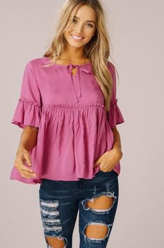 (1) Hollie Top – The Nod Boutique Flowy Tie Neck Top For Summer, Solid Color Summer Tops With Bow, Feminine Short Sleeve Peplum Top With Ruffle Hem, Feminine Summer Tops With Bow Detail, Spring Pink Peplum Top With Ruffles, Spring Feminine Peplum Top With Ruffle Sleeves, Pink Feminine Peplum Top, Cute Ruffled Flutter Sleeve Blouse, Spring Feminine Ruffle Sleeve Peplum Top