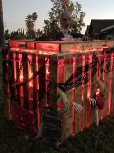 an old man sitting on top of a wooden crate with red lights around his body