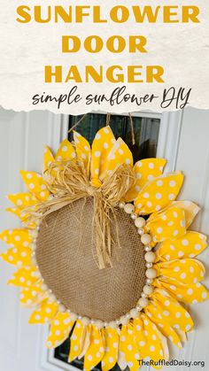 a sunflower door hanger made out of burlock and yellow polka dots