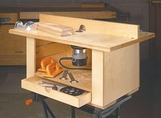 a workbench with tools in the drawer