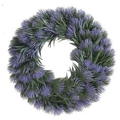 a wreath with purple flowers and green leaves