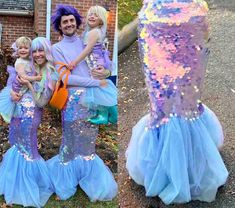 two adults and three children dressed up as mermaids in front of a brick building