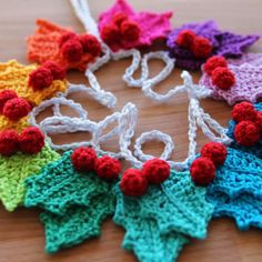 several crocheted ornaments are arranged on a table with strings attached to the string