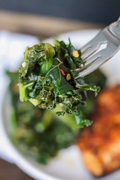 a close up of a fork with food on a plate