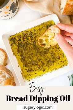 a person dipping bread into a dish with pesto on it and the words easy bread dipping oil