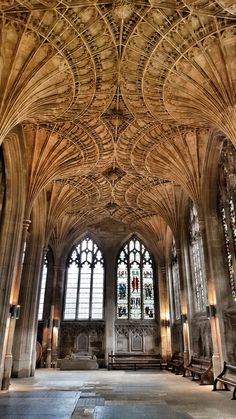 the interior of an old cathedral with stained glass windows