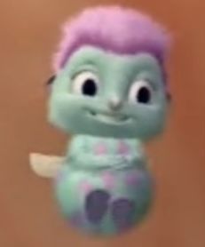 a close up of a stuffed animal with purple hair