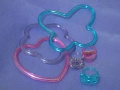 several different types of baby pacifiers on a blue background with the word hello kitty