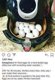 an open air fryer filled with eggs on top of a counter