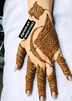 a henna on someone's hand with the tag