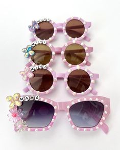 "Mama and Mini sunglasses!! These are absolutely adorable!!    These Sunnies are perfect for all year around to style it out and match your mini--whether your on, vacation, photoshoots, kids birthday parties, weddings, and more! Match your mini with these adorable sunnies.  . HOW TO ORDER: Step 1: Pick sunglasses color. *(for reference, Lilac is the color pictured).  Step 2: Pick letter bead color. LETTER BEADS AVAILABLE: * White/Black  * White/Gold  * White/Rainbow Multicolored  * Gold/Black  * Silver/Black  *Flower colors will vary and will be placed as seen fit. * Anti-Glare * UV Protection (UVA & UVB) * Durable and shatterproof * They open and close smoothly * Each item is made to order and will be ready to ship in 3-5  business days! If you need your order sooner. Please check out my Summer Birthday Sunglasses With Tinted Lenses, Summer Tinted Sunglasses For Birthday, Novelty Plastic Sunglasses With Tinted Lenses, Novelty Sunglasses With Tinted Plastic Lenses, Fun Pink Sunglasses For Gift, Cute Customizable Sunglasses For Gift, Playful Personalized Pink Sunglasses, Pink Tinted Sunglasses As Gift, Trendy Summer Sunglasses For Birthday