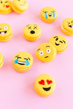 some yellow macaroons with different emoticions on them