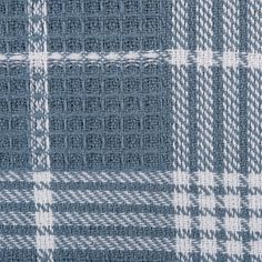 a blue and white plaid fabric textured with some small stitching on the side