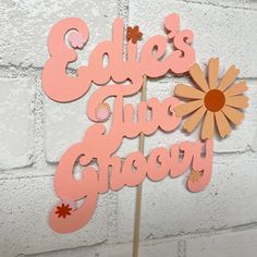 a cake topper that says edie's the ghogy on it