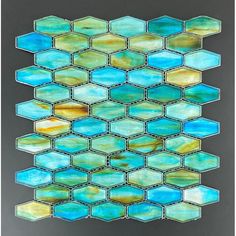 a glass mosaic tile with blue and yellow colors