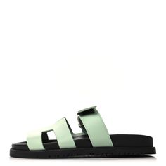 This is an authentic pair of HERMES Epsom Womens Chypre Sandals size 36 in Vert Jade. These stylish sandals are crafted of leather in pale green. They feature a toe strap across-over large Hermes H and an adjustable strap. Stylish Sandals, Pale Green, Jade, Adjustable Straps, Sandals, Green, Leather