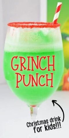 a green drink with a red and white striped straw in it's glass that says grinch punch christmas drink for kids