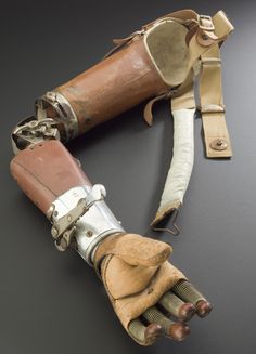 an old pair of leather gloves with metal fittings