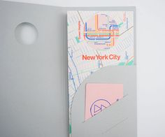 the new york city subway map is displayed on a piece of paper that has been cut out