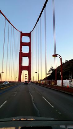 a car driving over the golden gate bridge