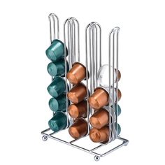 a rack that has several cups in it and one is filled with teal, orange, and brown