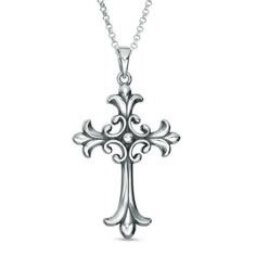 a silver cross necklace with filigrees is shown on a white background,