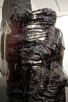 an abstract sculpture is covered in plastic wrap