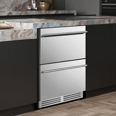 a stainless steel dishwasher in the middle of a kitchen with marble counter tops