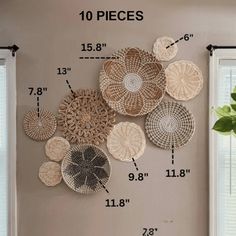 a wall with several pieces of woven art hanging on it's side and measurements for each piece