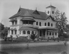 an old black and white photo of a large house