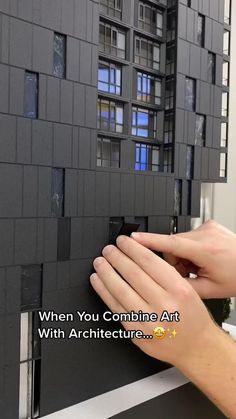 two hands are holding onto the side of a building with black tiles on it and text that reads, when you combine art with architecture