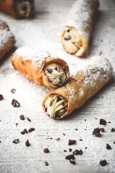 some food is laying out on a table with powdered sugar and raisins