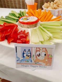 there are many vegetables on the table with some signs in front of them that say magic veggie sticks