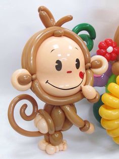 there is a balloon monkey next to some balloons