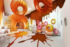 an artist's rendering of a doughnut shop with donuts dripping down the walls