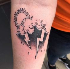 a black and white photo of a lightning tattoo on the arm