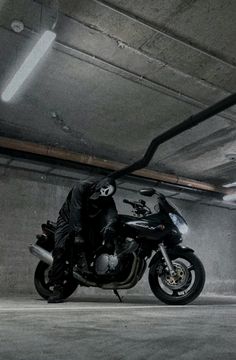 a motorcycle is parked in a parking garage